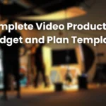 Blurred film set background with crew and lighting equipment, overlaid with text “Complete Video Production Budget and Plan Template,” representing tools and resources for organizing a professional video production budget and schedule.